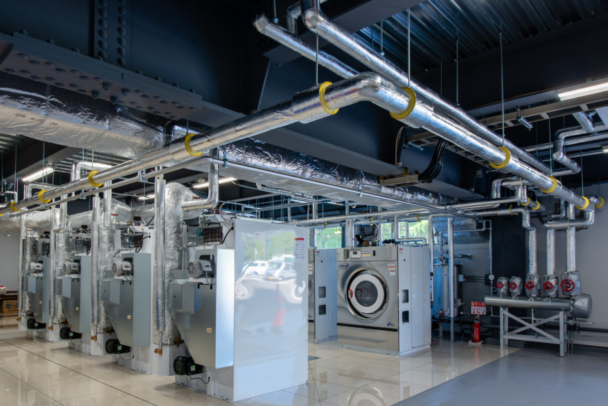 某工場内洗濯乾燥機器導入に伴う給排水・空調・換気・蒸気配管工事